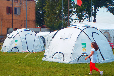ShelterBox tents set up on a football pitch bringing shelter to families made homeless by the disaster in San Felice.