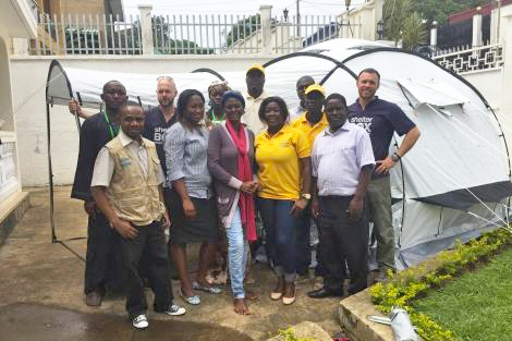 Image of ShelterBox response team members Todd Finklestone (US) and Ryan Schaafsma (US), along with staff at aid agency IEDA Relief in Cameroon.