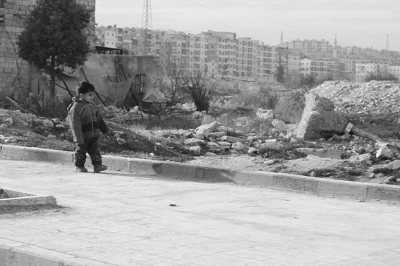 Aleppo - child with destroyed cityscape background